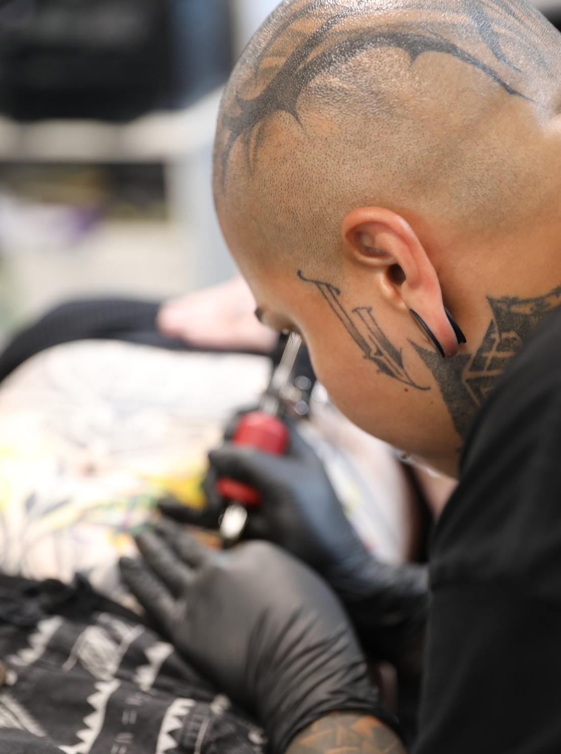 tattoo artist inking clients stomach